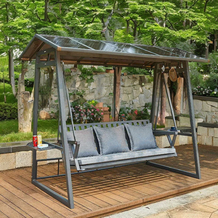 Agio springdale patio swing with canopy and accent online pillows